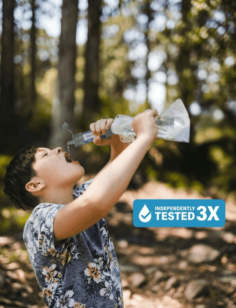 A Child is drinking water using survival sip water filter